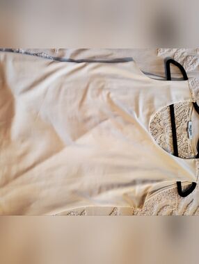 Off White Sleveless Top With Lovely Back Detailing